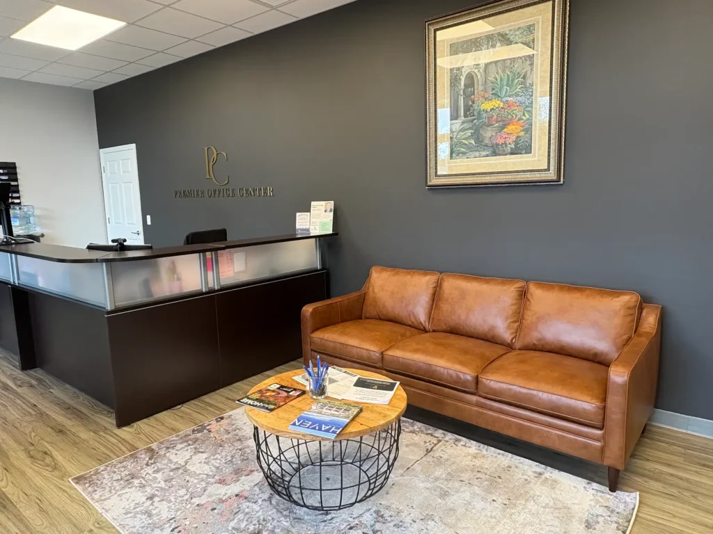 furnished office suites with reception desk at Premier Office Center
