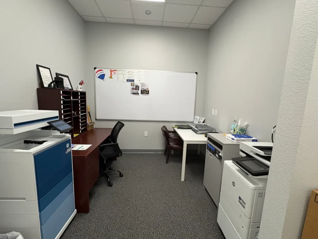 private office suites hallway with natural light at Premier Office Center